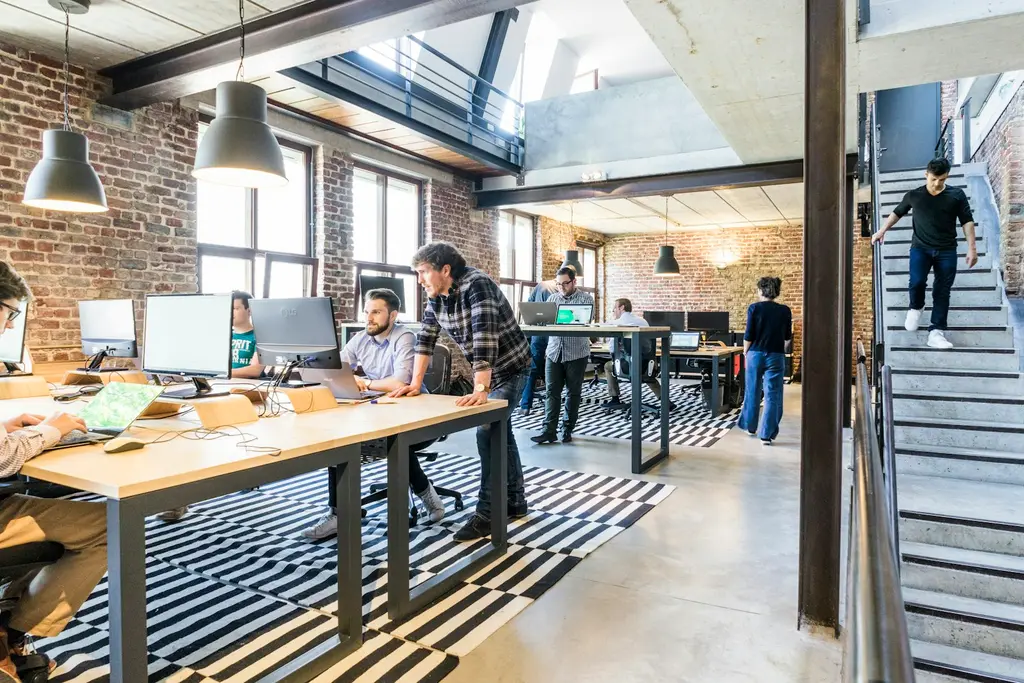 A team working together at desks in a bright, modern open-plan office
